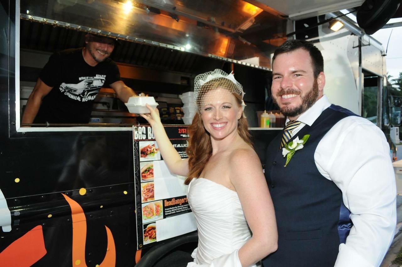 Couple by Food Truck at Wedding Service