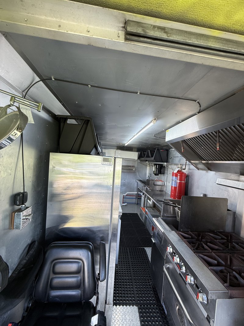 Food truck cooking line with range and exhaust hood