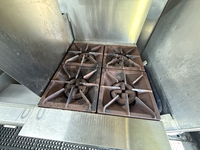Four burner range in food truck