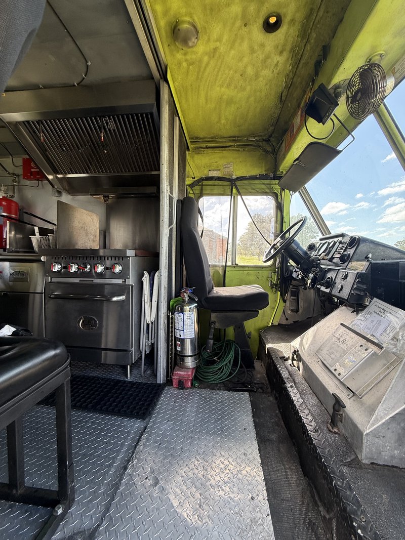 1998 Freightliner food truck cab looking into kitchen