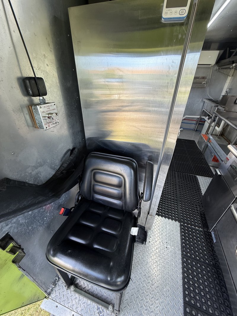 Food truck passenger seat with seat belt for staff