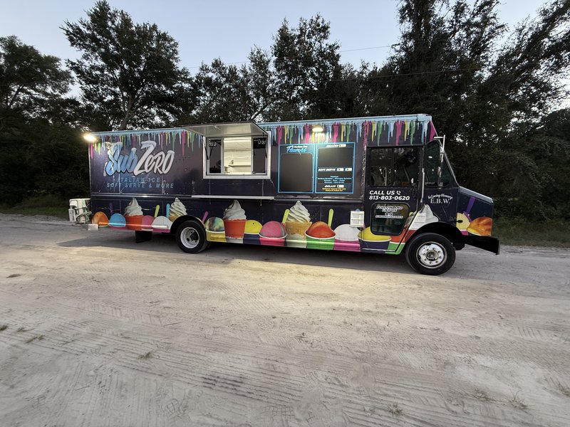 2012 Workhorse ice cream truck serving windows lit