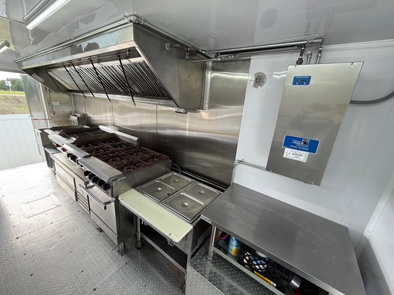 12-foot commercial exhaust hood system over charbroiler and gas range inside a 2022 Ford F59 food truck – Florid