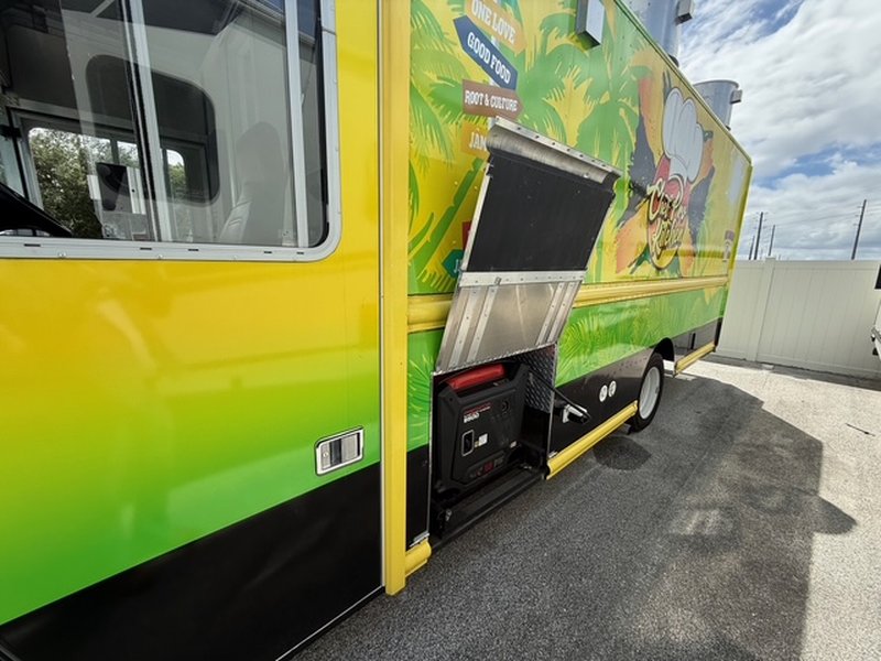 Driver side generator access compartment on a 2022 Ford F59 food truck showing Predator 9500 quiet inverter generator – Florida