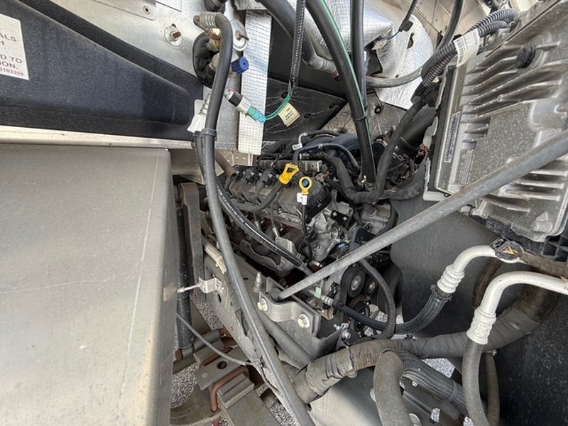 Engine detail of a 2022 Ford F59 food truck showing fuel injectors and wiring – low mileage unit for sale in Pasco County Florida