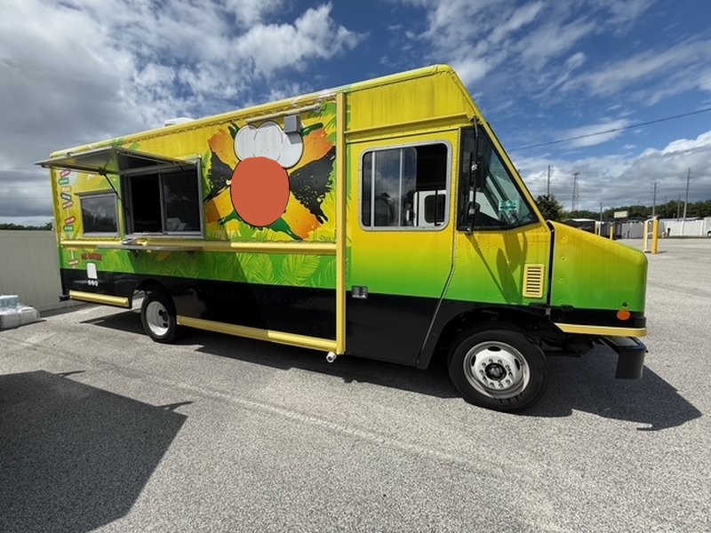 Full passenger side view of a 2022 Ford F59 food truck with service window open and tropical vinyl wrap – for sale in Pasco County Florida