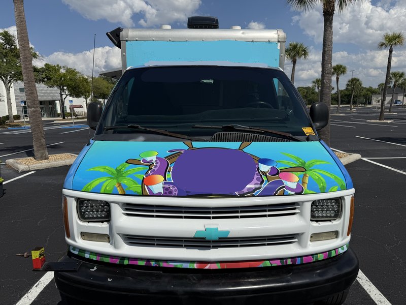 Front grille and hood of a 1997 Chevrolet Express 3500 shaved ice truck for sale in Tampa Bay, Florida