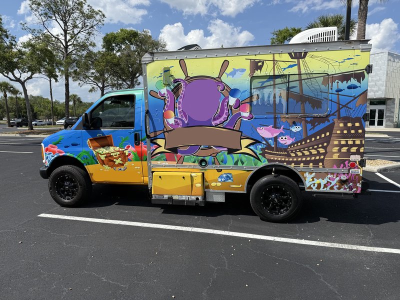 Custom-wrapped 1997 Chevrolet Express 3500 shaved ice and frozen treats food truck for sale in Florida — full driver-side view