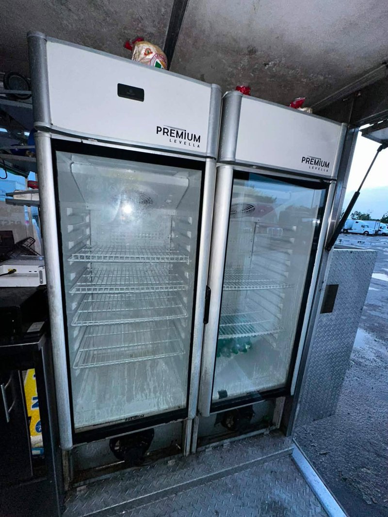 Coolers inside of food truck for sale in Orlando Two glass door refrigerators